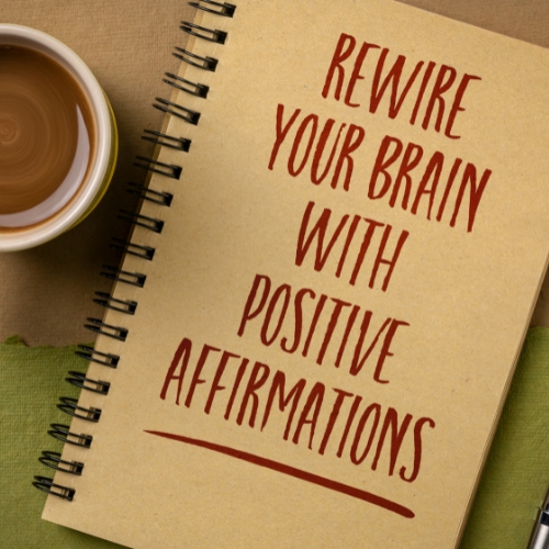a book with rewire your brain with positive affirmations written on it