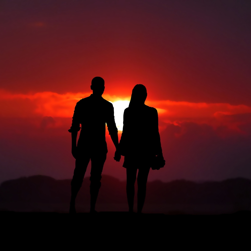 couple walking off into the sunset together in a healthy relationship