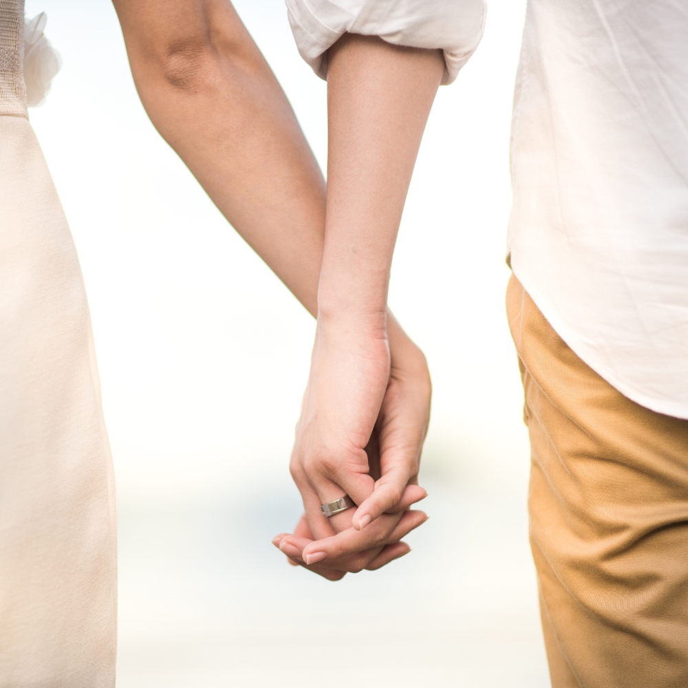 two people holding hands secure healthy relationship