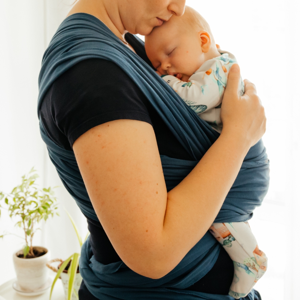 woman cradling baby secure attachment style bond
