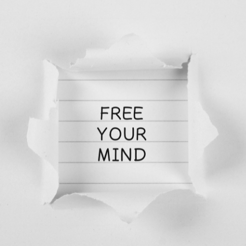 a piece of paper saying free your mind, the tagline of Psych-k