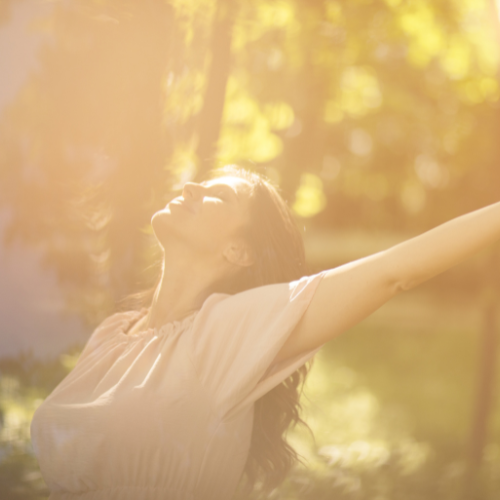 woman feeling free in nature after letting her higher self lead